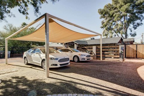 Carport with a shade sail