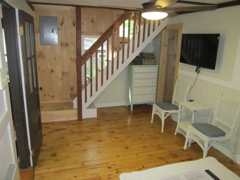 Staircase and television in the living area