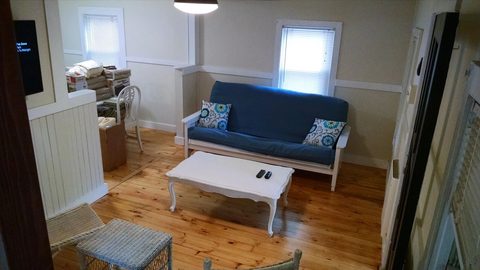 Living room with a blue sofa and coffee table