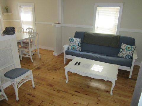 Living room with a blue sofa by a window