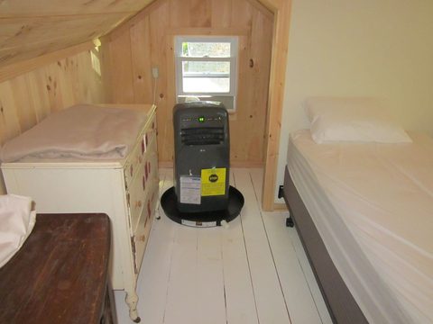 Bedroom with a dresser and window