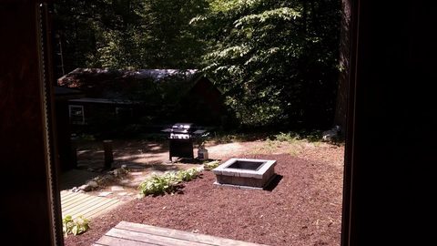 Fire pit area in the woods at dusk